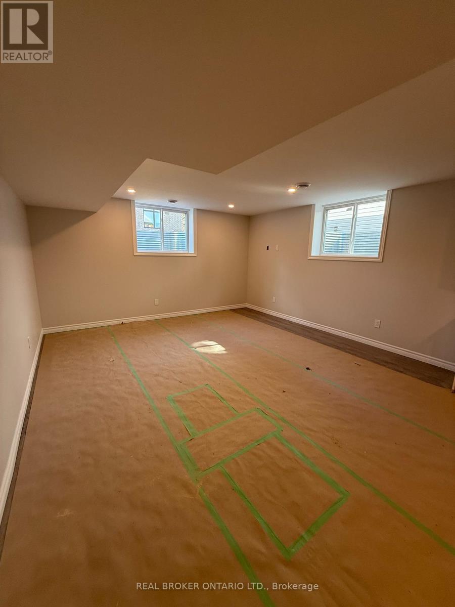 A room with a wooden floor and green lines drawn on it.