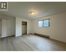 A room with a window and a door.