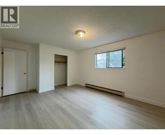 A room with a window and a door.