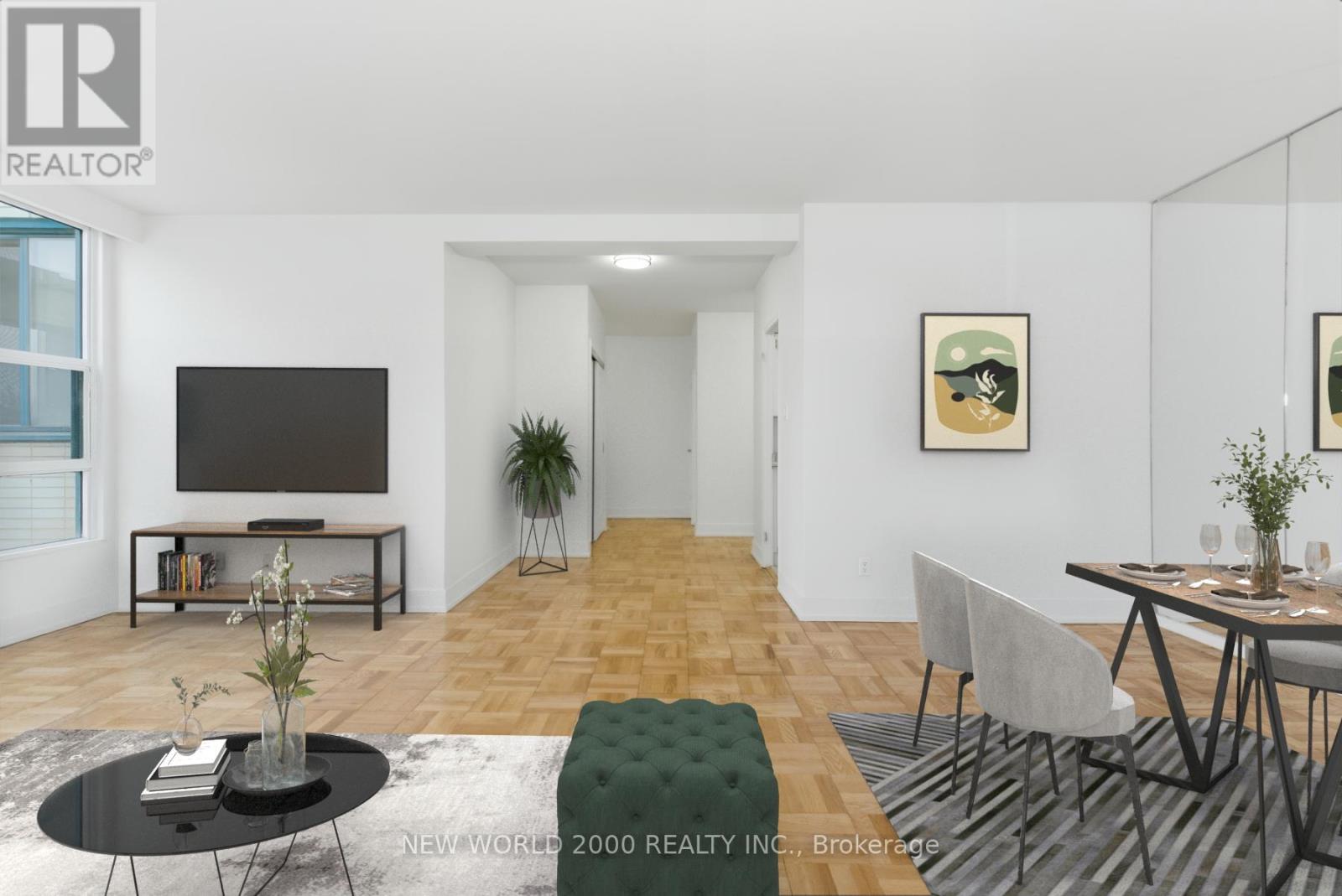 A living room with a black coffee table and a grey sofa.