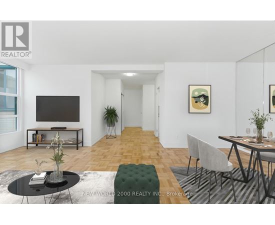 A living room with a black coffee table and a grey sofa.