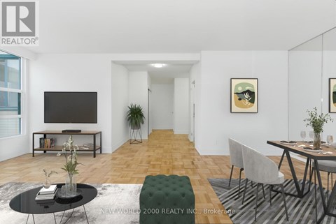 A living room with a black coffee table and a grey sofa.