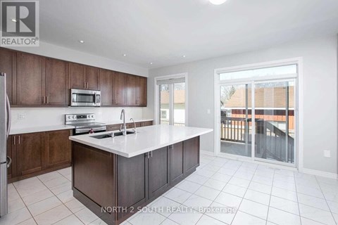 A kitchen with brown cabinets and white countertops.