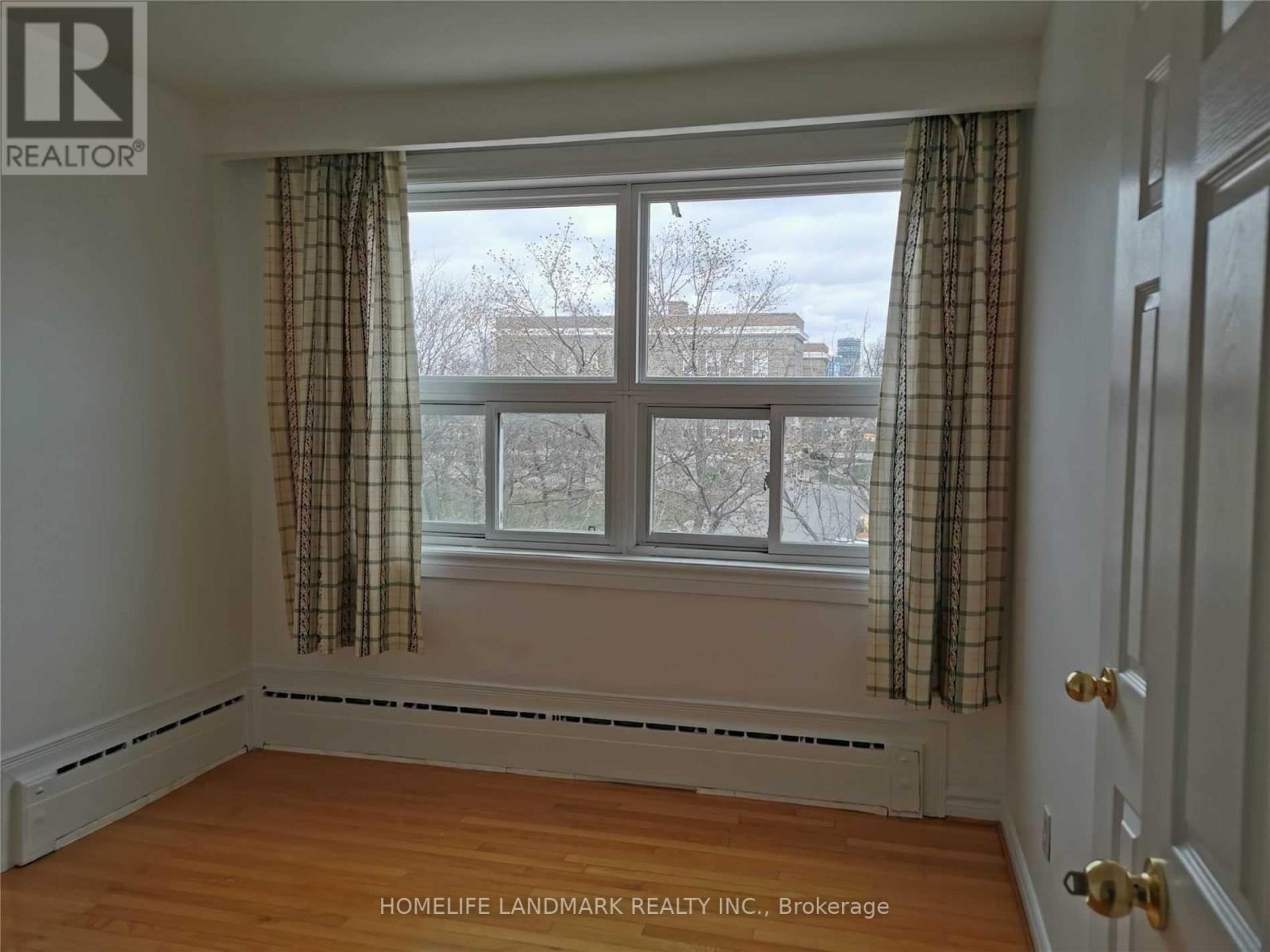 A room with a window and a door.
