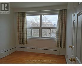 A room with a window and a door.