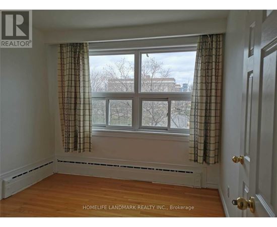 A room with a window and a door.