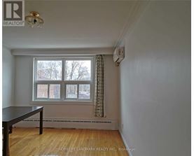 A room with a table and a window.
