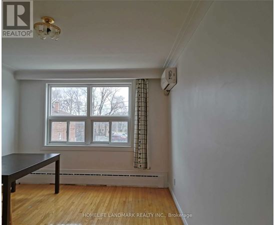 A room with a table and a window.