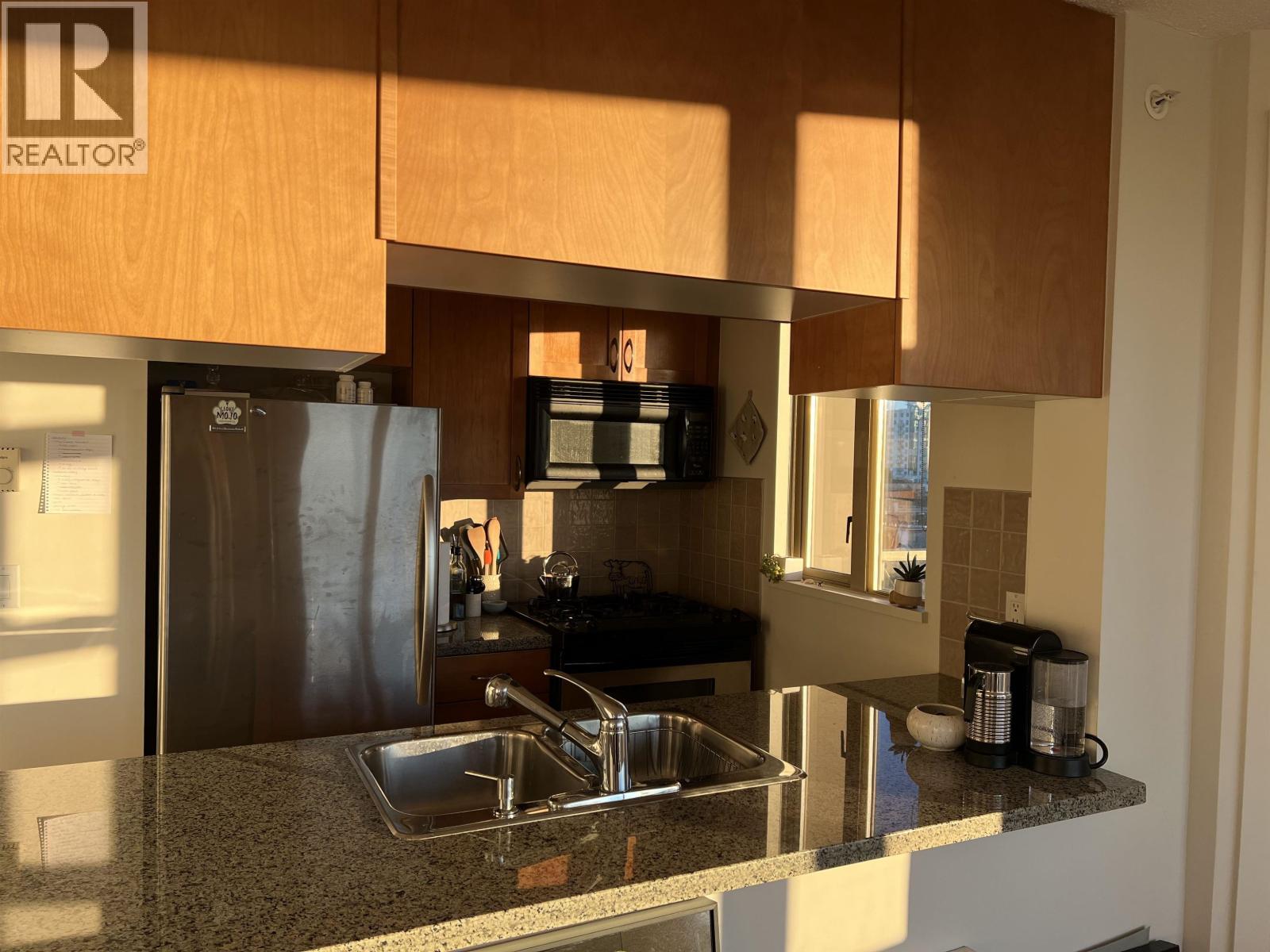 A kitchen with a sink and cabinets.