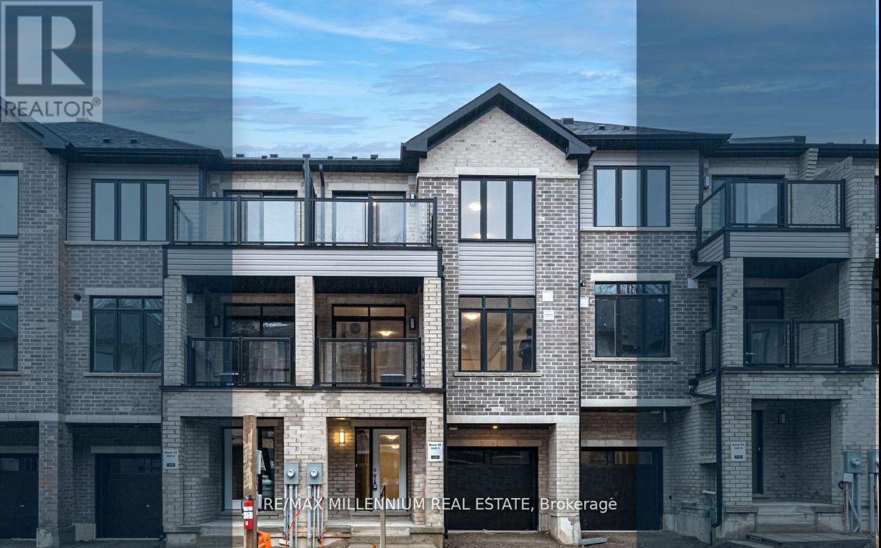 A modern multi-story residential building with balconies and large windows.