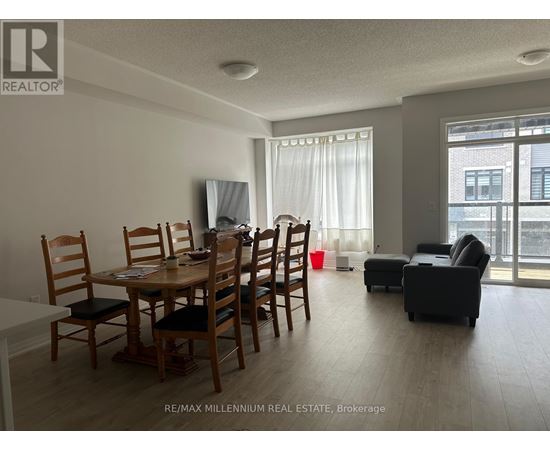 A dining room with a wooden table and chairs.