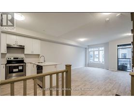 A kitchen with white cabinets and a stove top oven.