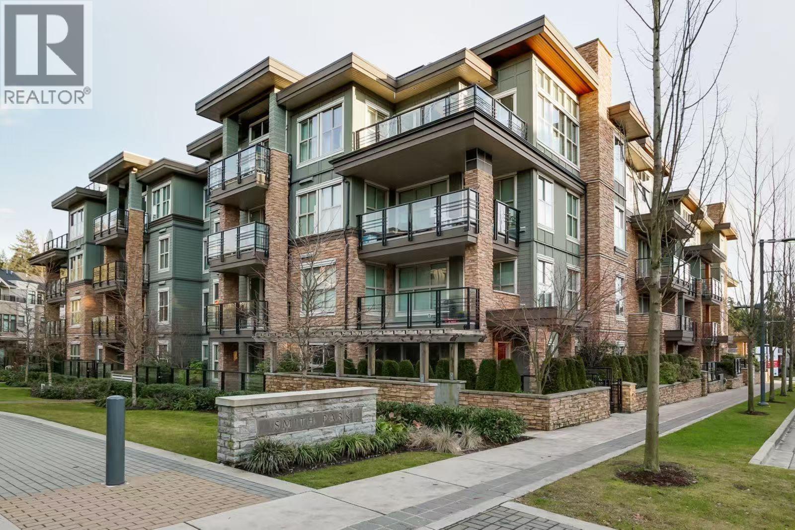 A modern apartment building with balconies and a brick facade.