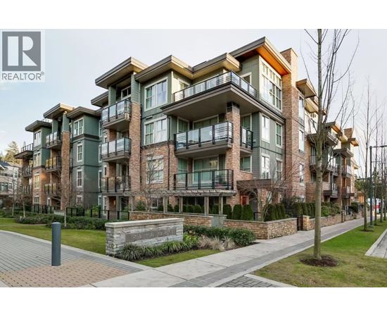 A modern apartment building with balconies and a brick facade.