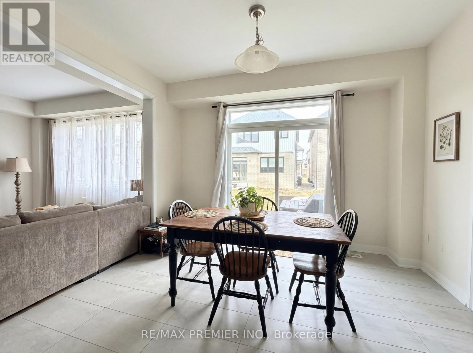 A dining room with a table set for four.