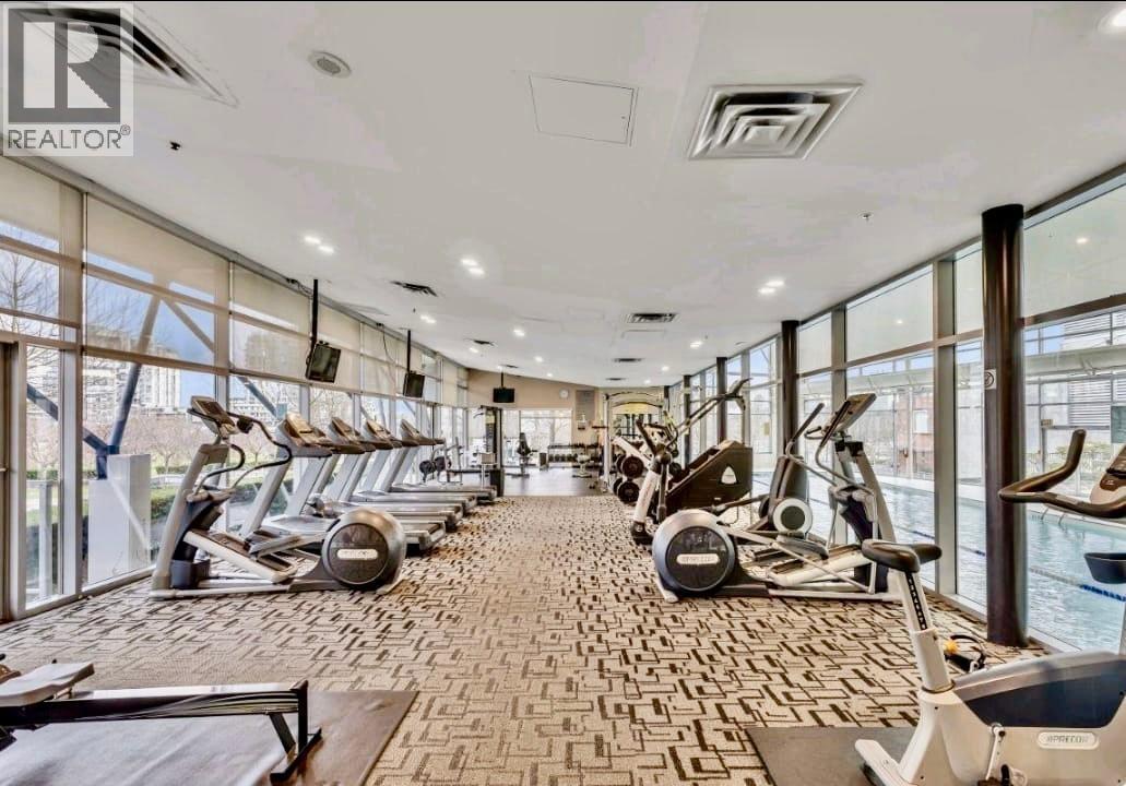 A gym with treadmills and elliptical machines.