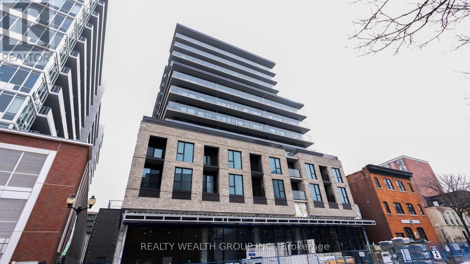 A building with the words REALTY WEALTH GROUP on it.