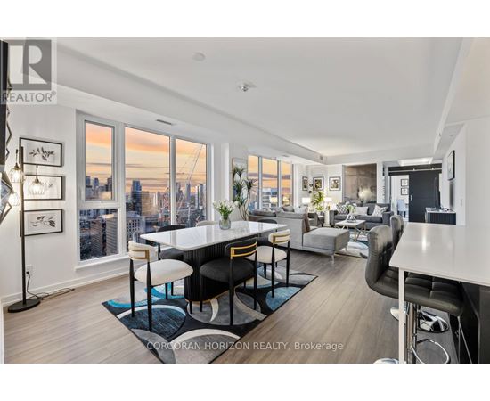 A well-lit, modern living room with a view of the city skyline.