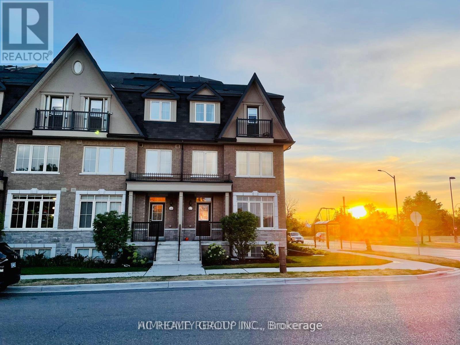 A house with a sunset in the background.