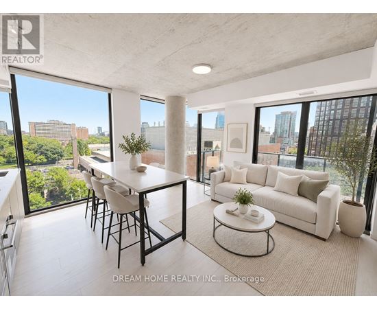 A modern living room with a dining table and a couch.