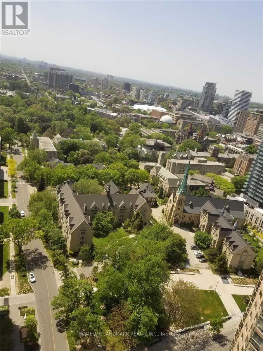 A bird's eye view of a residential area with houses and trees.