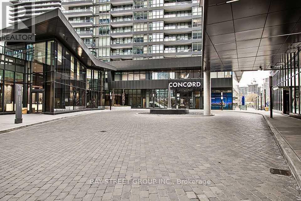 A large open space in front of a building with the word Concord on it.