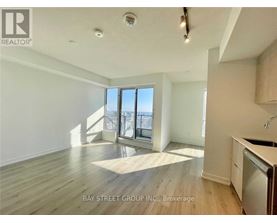 A spacious room with a view of the city through the windows.
