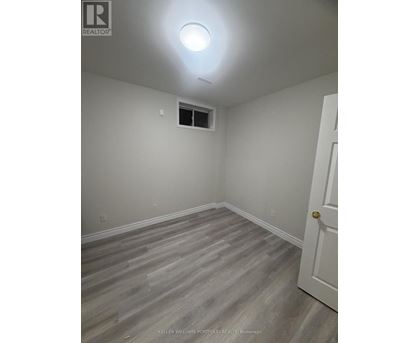 A room with a door and a window.