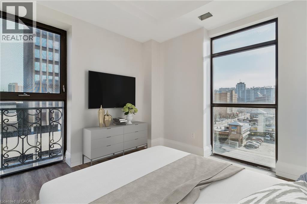 A bedroom with a large bed and a flat screen TV.