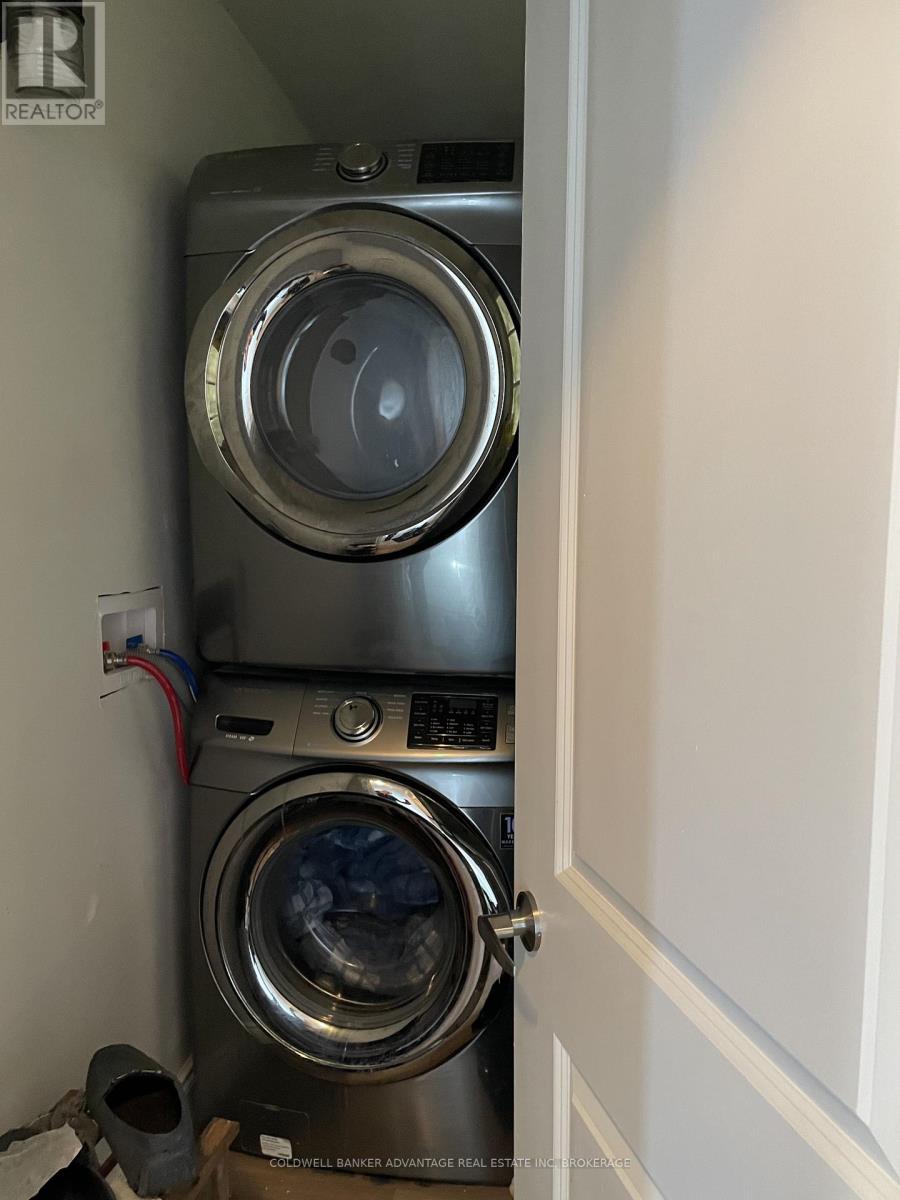 A washer and dryer stacked on top of each other in a small space.