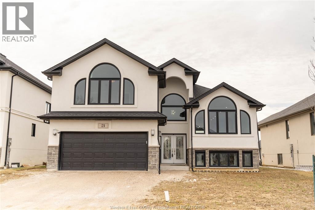 A two-story house with a garage is for sale.