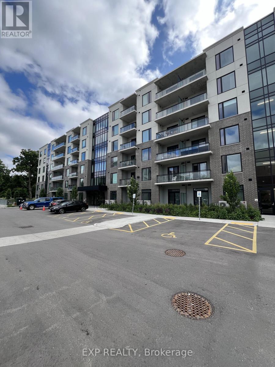 A large building with a parking lot in front of it.