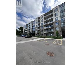 A large building with a parking lot in front of it.