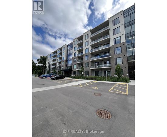 A large building with a parking lot in front of it.