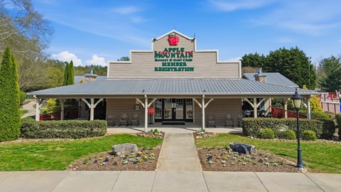 A building with a sign that reads "Apple Manor Nursing Home".