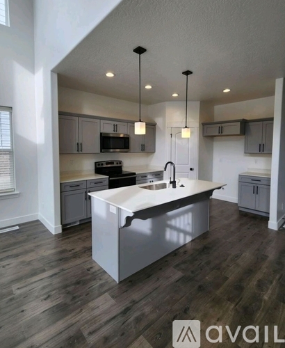 A modern kitchen with a large island in the middle.