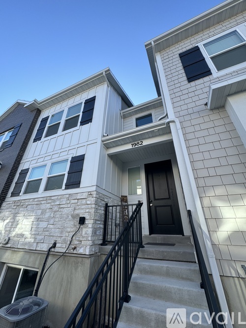 A house with the number 1982 on the front.