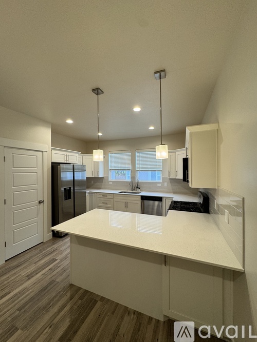 A modern kitchen with a large island in the middle.