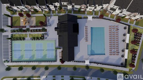 A bird's eye view of a residential area with a swimming pool and a large building.