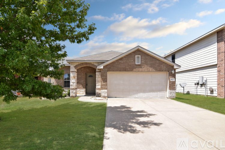 A house with a garage and a driveway.