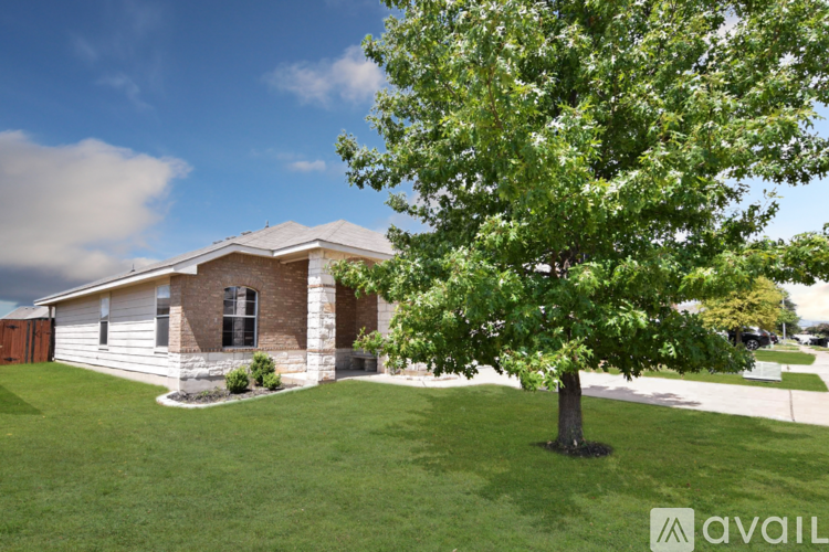 A house with a tree in front of it.