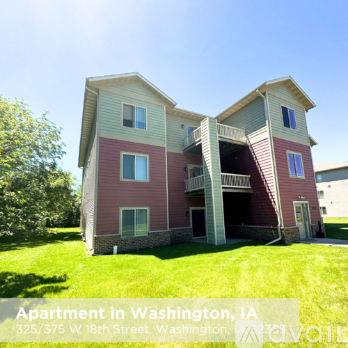 Apartment building with a red and beige exterior in Washington, IA.