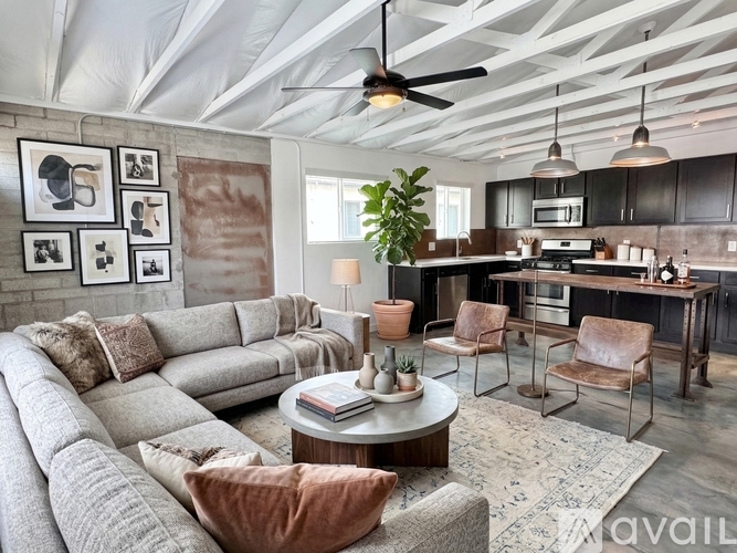 A living room with a grey sofa and a coffee table.
