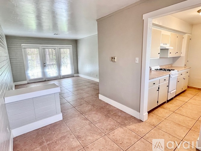 A kitchen with a countertop and a window.