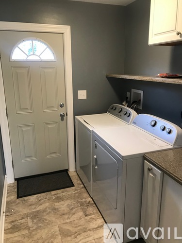 A washer and dryer in a laundry room.
