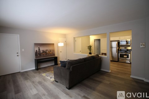 A living room with a couch and a bar area.
