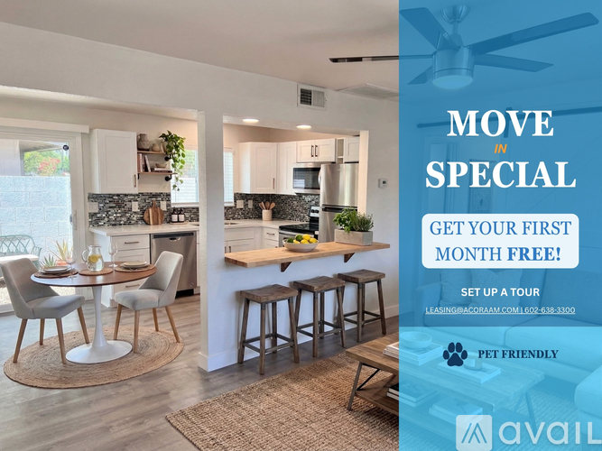 A modern kitchen with a dining table set up and a sign offering a free first month for a move in special.