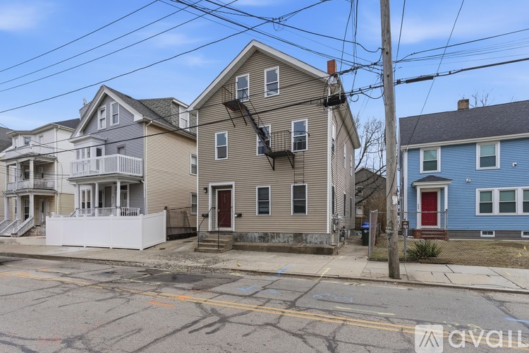 A row of houses with a blue house on the right.