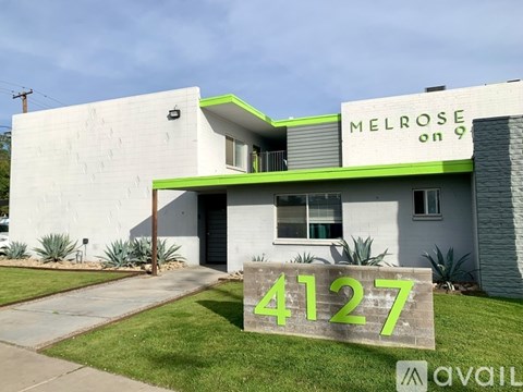 A house with the number 4127 on a sign in front of it.
