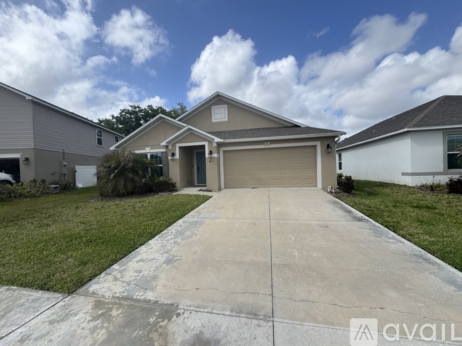 A house with a driveway in front of it is for sale.